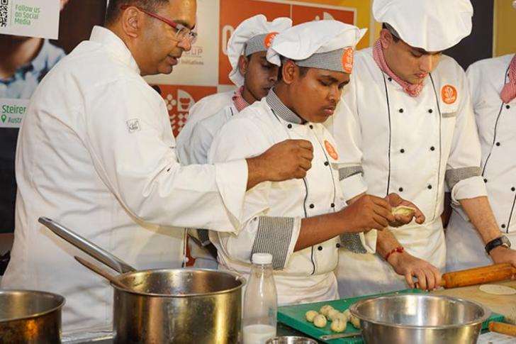 Students assisting chef Chopra